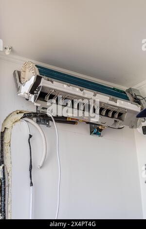 Installing an air conditioner in an apartment office, Lviv Ukraine 08.04.24 Stock Photo