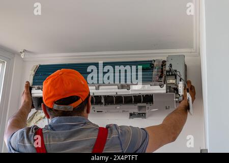 Repairman team installing air conditioner Lviv Ukraine 08.04.24 Stock Photo