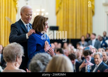 Washington, United States Of America. 03rd May, 2024. Washington, United States of America. 03 May, 2024. U.S President Joe Biden, presents the Presidential Medal of Freedom to former House Speaker Rep. Nancy Pelosi during the awards ceremony at East Room of the White House, May 3, 2024 in Washington, DC The Presidential Medal of Freedom is the nation's highest civilian award. Credit: Adam Schultz/White House Photo/Alamy Live News Stock Photo