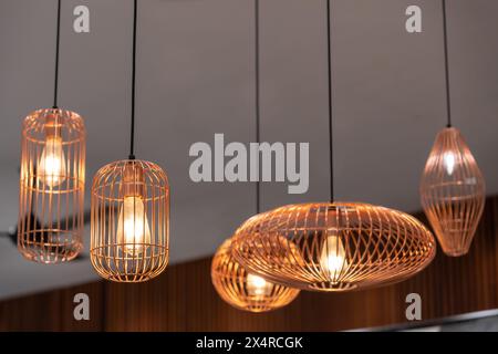 Different types of shape pendants light hanging on the ceiling Stock Photo