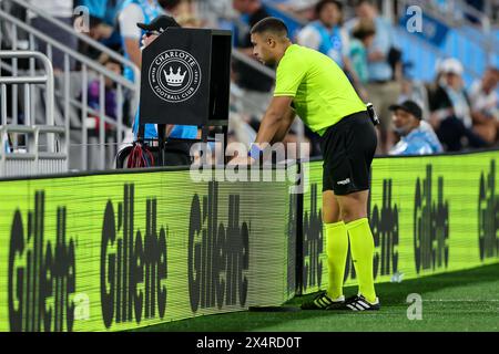 Charlotte, North Carolina, USA. 4th May, 2024. The match official reviews a play during the first half of the Charlotte FC vs Portland Timbers MLS match at Bank of America Stadium in Charlotte, NC on May 4, 2024. (Credit Image: © Cory Knowlton/ZUMA Press Wire) EDITORIAL USAGE ONLY! Not for Commercial USAGE! Credit: ZUMA Press, Inc./Alamy Live News Stock Photo