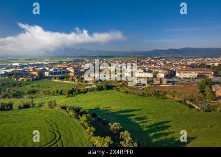 Aerial view of the town of Santpedor on a spring morning with some high fogs (Bages, Barcelona, Catalonia, Spain) Stock Photo