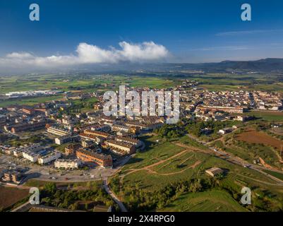 Aerial view of the town of Santpedor on a spring morning with some high fogs (Bages, Barcelona, Catalonia, Spain) Stock Photo