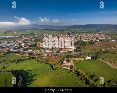 Aerial view of the town of Santpedor on a spring morning with some high fogs (Bages, Barcelona, Catalonia, Spain) Stock Photo