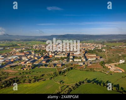 Aerial view of the town of Santpedor on a spring morning with some high fogs (Bages, Barcelona, Catalonia, Spain) Stock Photo