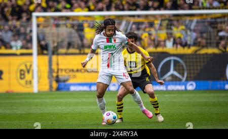 Dortmund, Germany. 4th Mai 2024.  Kevin Mbabu (FCA) Mateu Morey (BVB) Borussia Dortmund - FC Augsburg 04.05.2024    Copyright (nur für journalistische Stock Photo