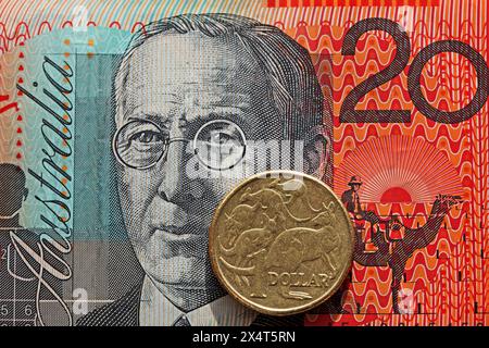 Australian twenty dollar note and one dollar coin Stock Photo