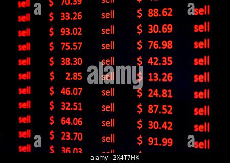 Red financial figures and the word sell on a computer screen. Symbolic of a share market crash. Stock Photo