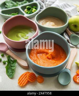 Healthy baby food in bowls.  Various bowls of fruit and vegetable puree, top view Stock Photo