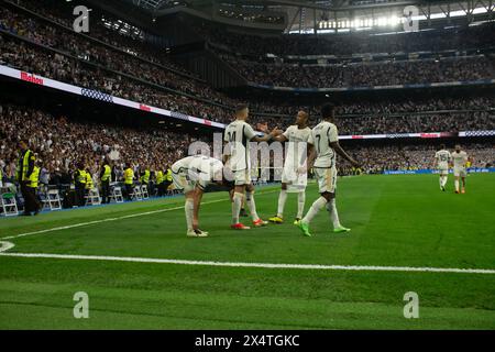 Madrid, Spain. 04th May, 2024. Joselu (14) greets Militao to celebrate after scoring 3-0 in favor of Real Madrid. Real Madrid this afternoon became champion of the League after beating Cadiz at the Santiago Bernabeu stadium by 3 goals to 0 with goals from Brahim, Bellingham and Joselu and after CF Barcelona lost to Girona. Credit: SOPA Images Limited/Alamy Live News Stock Photo