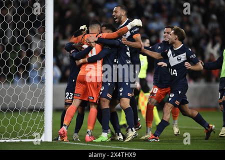 MELBOURNE, AUSTRALIA. 5 May 2024. Pictured: Portuguese Roderick Miranda(21) of Melbourne Victory leaps into the crowd of Victory players hugging Paul Izzo(20) of Melbourne Victory after beating Melbourne City 3-2 on penalties during the A Leagues Soccer, Melbourne Victory FC v Melbourne City FC elimination series at Melbourne's AAMI Park. Credit: Karl Phillipson/Alamy Live News Stock Photo