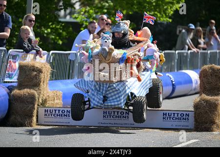 Essex, UK. 5th May 2024. Competitors take part in the Billericay Soapbox Derby in Essex UK. The Derby organised by Billericay Town Rotary Club is run on a closed section of public road off the Towns High Street. Credit: MARTIN DALTON/Alamy Live News Stock Photo