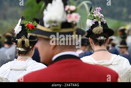 Lenggries, Germany. 05th May, 2024. Women sutlers follow the service for the patron saint's day of the Bavarian mountain marksmen. Around 4000 marksmen celebrate in honor of the Mother of God, who is their patron saint. Credit: Angelika Warmuth/dpa/Alamy Live News Stock Photo