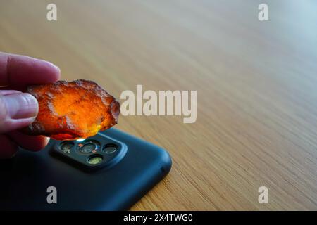 Gemstone under the spotlight of a flashlight Stock Photo