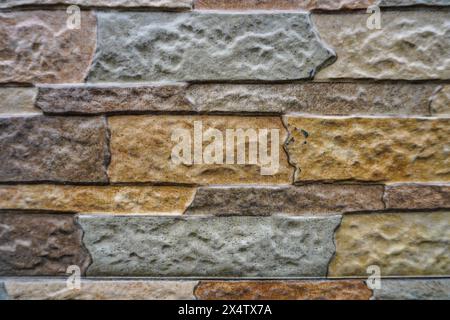 Neatly arranged natural stone wall background Stock Photo
