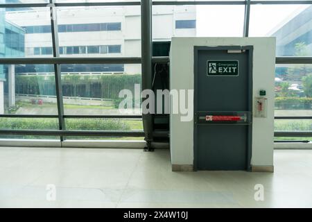 Emergency Exit Door in Airport Terminal Ensures Passenger Security Stock Photo