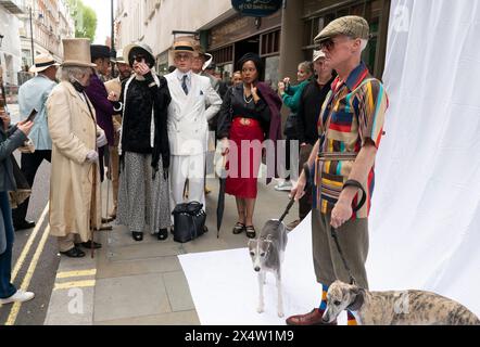 People attend the fourth Grand Flaneur Walk in Westminster, central London, which is a celebration of the pure, the immutable and the pointless. Picture date: Sunday May 5, 2024. Stock Photo