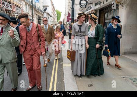 People attend the fourth Grand Flaneur Walk in Westminster, central London, which is a celebration of the pure, the immutable and the pointless. Picture date: Sunday May 5, 2024. Stock Photo