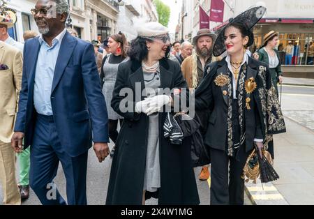 People attend the fourth Grand Flaneur Walk in Westminster, central London, which is a celebration of the pure, the immutable and the pointless. Picture date: Sunday May 5, 2024. Stock Photo