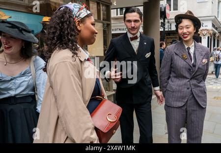 People attend the fourth Grand Flaneur Walk in Westminster, central London, which is a celebration of the pure, the immutable and the pointless. Picture date: Sunday May 5, 2024. Stock Photo