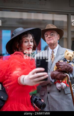 People attend the fourth Grand Flaneur Walk in Westminster, central London, which is a celebration of the pure, the immutable and the pointless. Picture date: Sunday May 5, 2024. Stock Photo