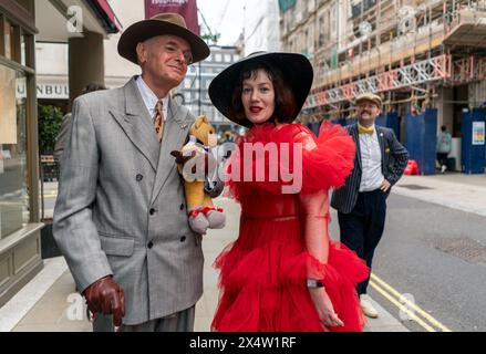 People attend the fourth Grand Flaneur Walk in Westminster, central London, which is a celebration of the pure, the immutable and the pointless. Picture date: Sunday May 5, 2024. Stock Photo