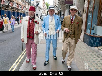 People attend the fourth Grand Flaneur Walk in Westminster, central London, which is a celebration of the pure, the immutable and the pointless. Picture date: Sunday May 5, 2024. Stock Photo