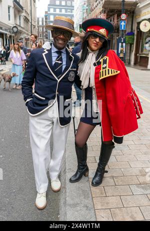 People attend the fourth Grand Flaneur Walk in Westminster, central London, which is a celebration of the pure, the immutable and the pointless. Picture date: Sunday May 5, 2024. Stock Photo