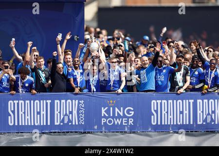 Leicester City players and management lift the trophy on the balcony during an open-top bus parade in Leicester to celebrate winning the Sky Bet Championship title. Picture date: Sunday May 5, 2024. Stock Photo