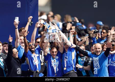 Leicester City players and management lift the trophy on the balcony during a parade in Leicester to celebrate winning the Sky Bet Championship title. Picture date: Sunday May 5, 2024. Stock Photo