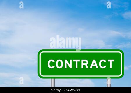 Green color transportation sign with word contract on blue sky with white cloud background Stock Photo