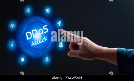 A hand pointing to a blue circle with the word ddos attack in white. The circle is surrounded by various icons, including a light, a cloud, and a glob Stock Photo