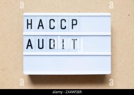 Lightbox with word HACCP (Hazard Analysis Critical Control Points) audit on wood background Stock Photo