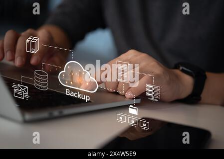 Businessman Interacting with a Backup Interface virtual cloud network data security system internet online with futuristic holographic digital technol Stock Photo