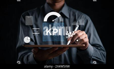 Analyzing financial data and key performance indicators KPI on a tablet device. Business digital dashboard statistics system goal assessment Stock Photo
