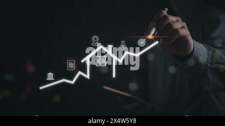 Hand drawing an upward trend on a digital graph, symbolizing growth and analytics. Stock Photo