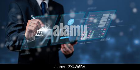 A businessperson interacts with a futuristic digital interface displaying bank security features. The image suggests advanced technology in financial Stock Photo