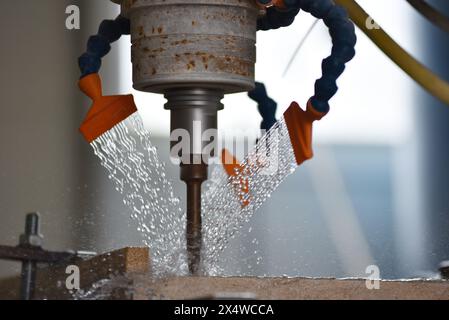 Robot working on milling sculpture in natural stone Stock Photo
