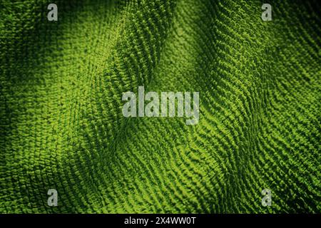 A green microfiber cleaning towel texture background. Close up. Stock Photo