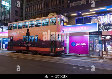 Hong Kong - April, 2024: Hong Kong Tramways is a public transport. Hong Kong Ding Ding with classic and unique style of double-deck tram. Stock Photo