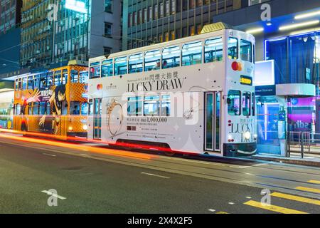 Hong Kong - April, 2024: Hong Kong Tramways is a public transport. Hong Kong Ding Ding with classic and unique style of double-deck tram. Stock Photo