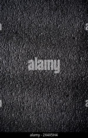 Black porous porous foam background. Background texture of black foam rubber Stock Photo
