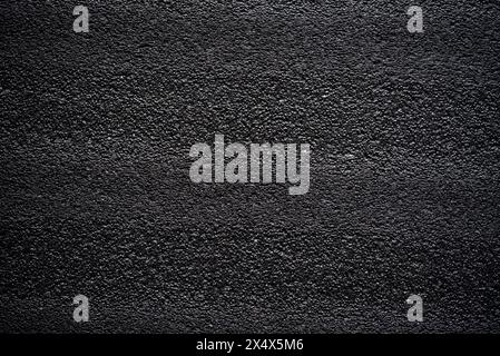 Black porous porous foam background. Background texture of black foam rubber Stock Photo