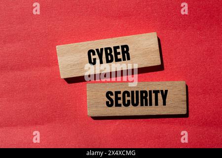 Cyber security words written on wooden blocks with red background. Conceptual cyber security symbol. Copy space. Stock Photo