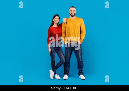 A Man and a Woman Standing Next to Each Other Stock Photo