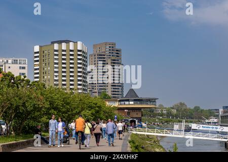 People enjoying warm spring weather on Rhine Promenade in Cologne Stock Photo