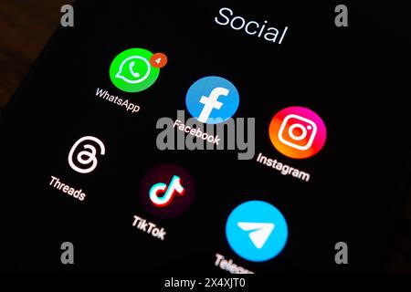 In this photo illustration, social networks (WhatsApp, Facebook, Instagram, Threads, TikTok and Telegram) logos seen displayed on a smartphone. Stock Photo