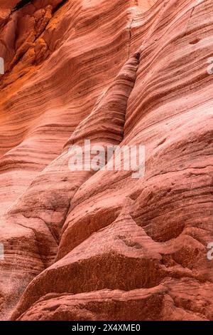 Swirl patterns on the sandstone walls of slot canyons in Arizona form from years of wind and water flow Patterns due to the soft rock composition. Stock Photo