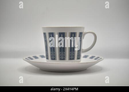tea cup and saucer with retro blue and white design Stock Photo