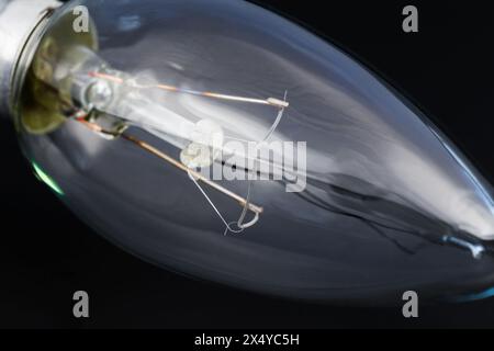 The internal structure of an incandescent lamp close-up on a dark background Stock Photo
